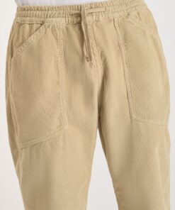 Pantalon de terciopelo beige de corte holgado y cinturilla elastica. 1