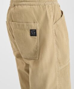 Pantalon de terciopelo beige de corte holgado y cinturilla elastica. 2