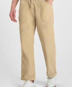 Pantalon de terciopelo beige de corte holgado y cinturilla elastica. 3