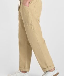Pantalon de terciopelo beige de corte holgado y cinturilla elastica. 6